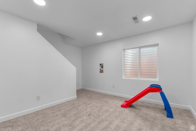 recreation room featuring carpet, baseboards, and recessed lighting