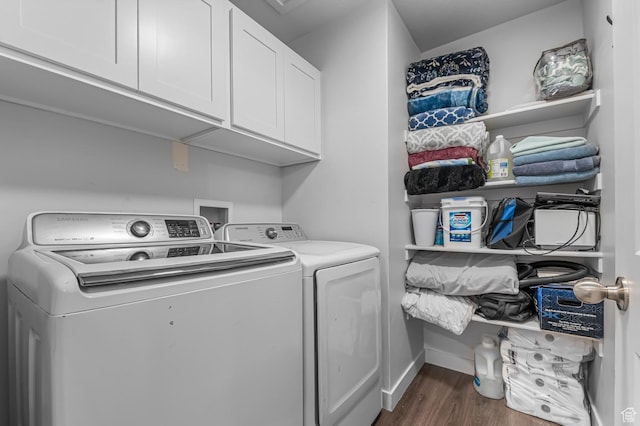 laundry area with independent washer and dryer, cabinet space, dark wood-style flooring, and baseboards