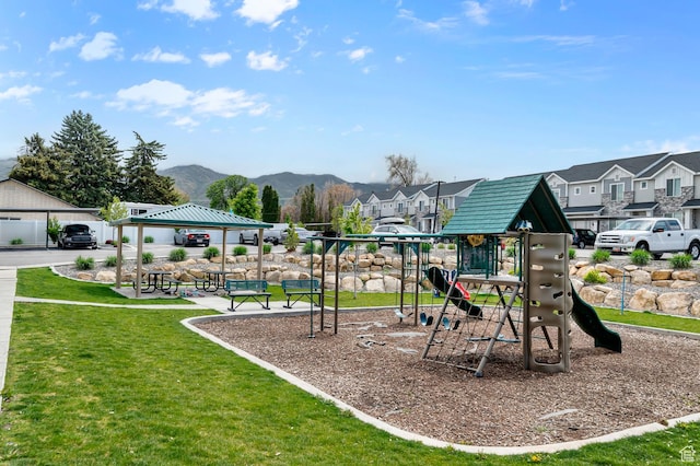 community jungle gym with a gazebo, a yard, a mountain view, and a residential view