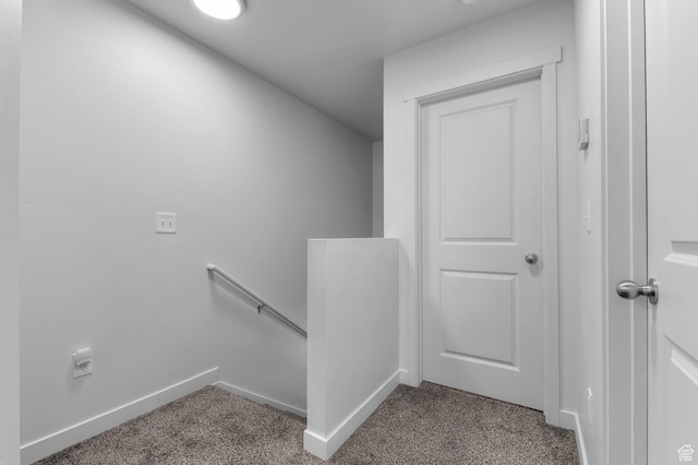 stairs featuring carpet floors and baseboards