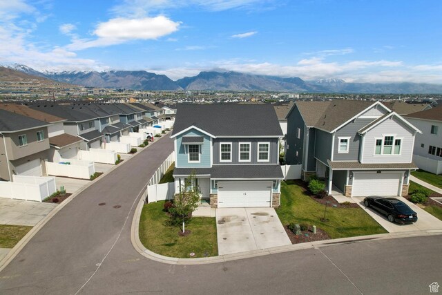 2546 N Wister Ln Unit 334, Lehi, UT 84043 - view of front facade featuring a residential view, a garage, and concrete driveway