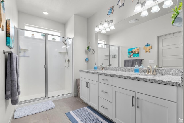 2546 N Wister Ln Unit 334, Lehi, UT 84043 - full bathroom with a stall shower, tile patterned floors, and double vanity