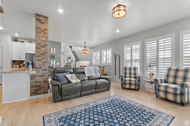 2546 N Wister Ln Unit 334, Lehi, UT 84043 - living room featuring stairs, light wood-type flooring, recessed lighting, and baseboards