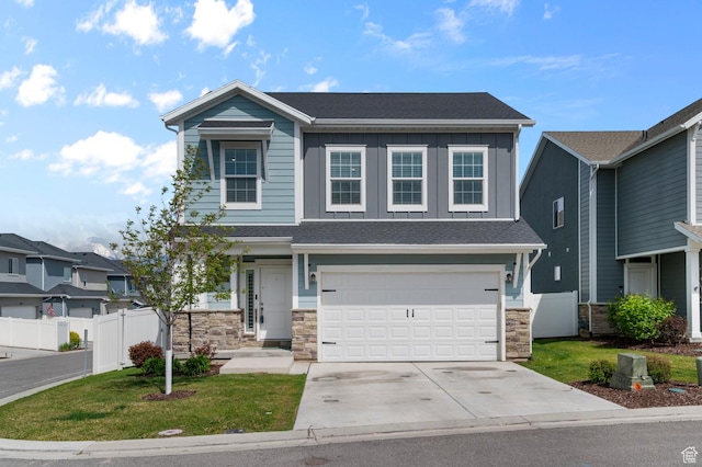 2546 N Wister Ln Unit 334, Lehi, UT 84043 - view of front facade with board and batten siding, stone siding, concrete driveway, a garage, and a shingled roof