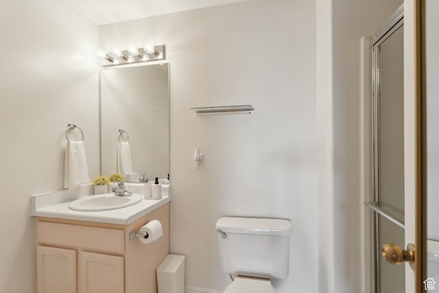 bathroom with toilet and vanity