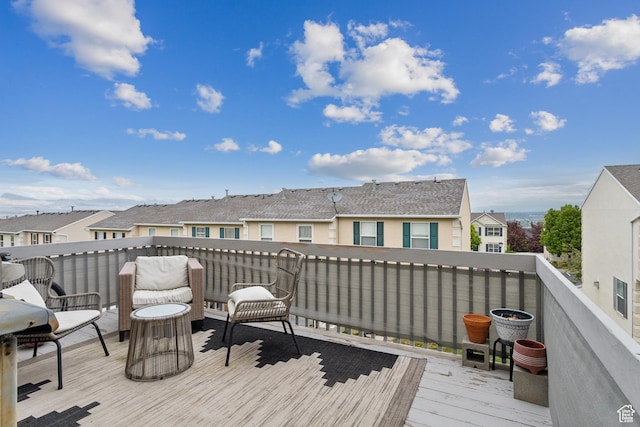wooden deck featuring a residential view