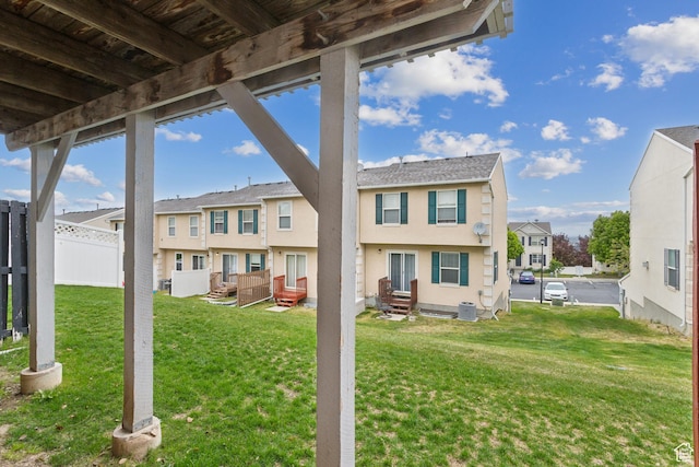 back of property featuring a residential view and stucco siding