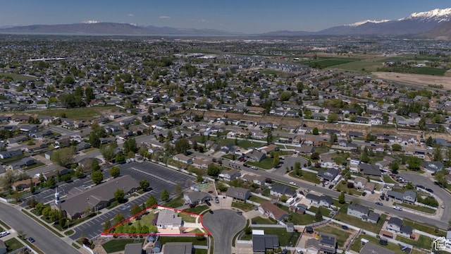 aerial perspective of suburban area with a mountainous background and property boundaries highlighted