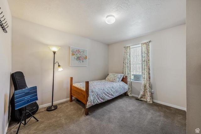 bedroom featuring carpet floors and baseboards