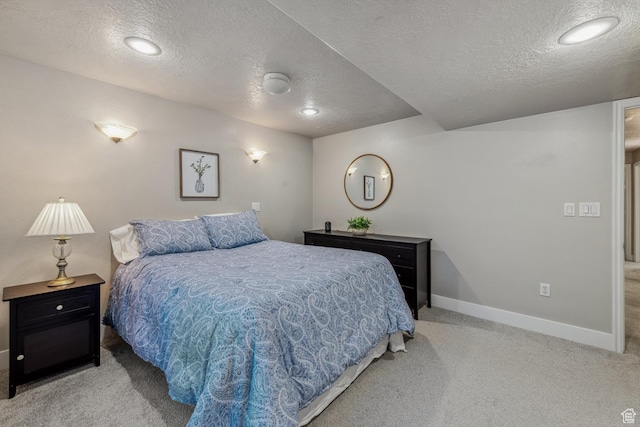 bedroom with a textured ceiling, carpet flooring, baseboards, and recessed lighting