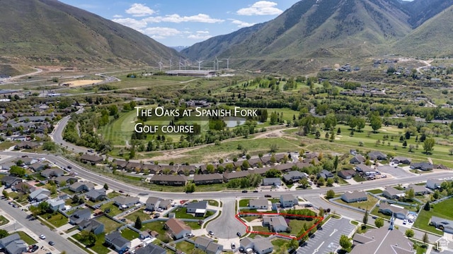 aerial view of property and surrounding area with property parcel outlined and mountains