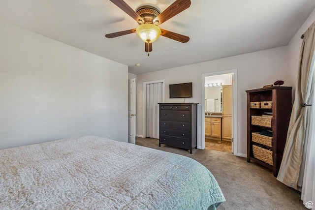 bedroom with carpet flooring, ceiling fan, connected bathroom, and baseboards