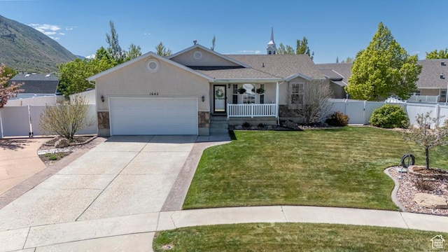ranch-style home with covered porch, a garage, driveway, stucco siding, and a gate