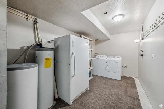 laundry room with washer and dryer, a textured ceiling, and carpet floors