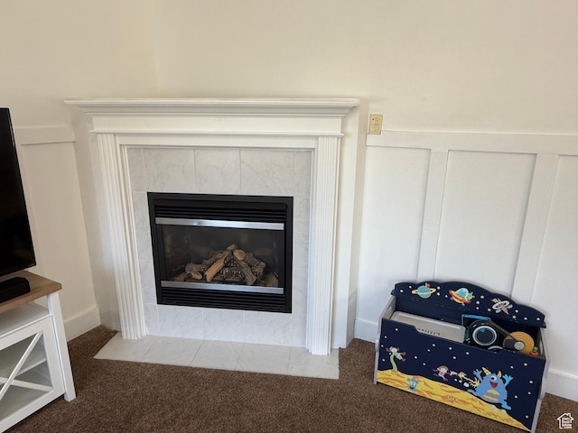 detailed view of carpet floors and a tiled fireplace