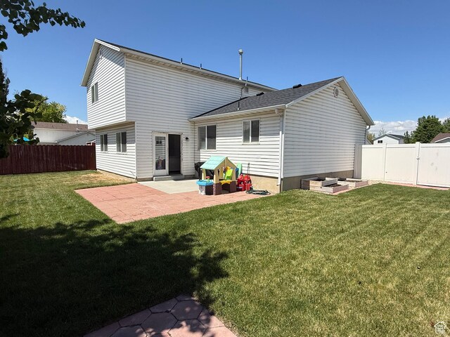 rear view of property with a patio area
