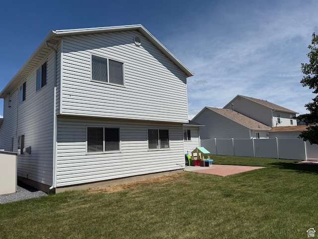 rear view of property with a patio area