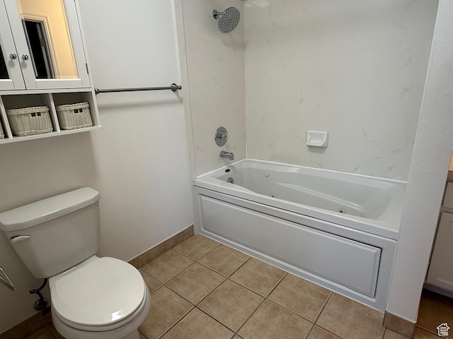 full bathroom featuring toilet, a combined bath / shower with jetted tub, tile patterned floors, and baseboards