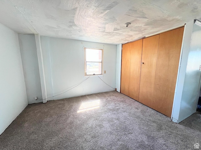 unfurnished bedroom featuring carpet flooring