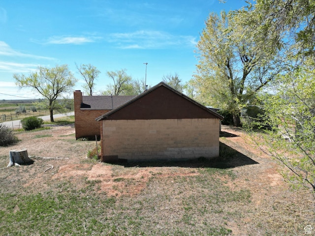 view of side of property with a chimney