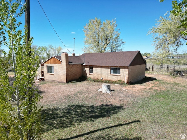 rear view of house featuring brick siding