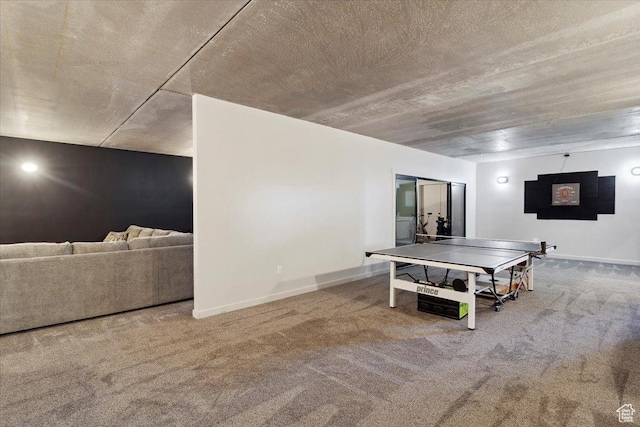 rec room with carpet and baseboards