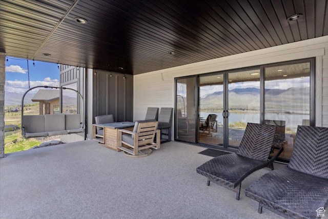 view of patio with a water view
