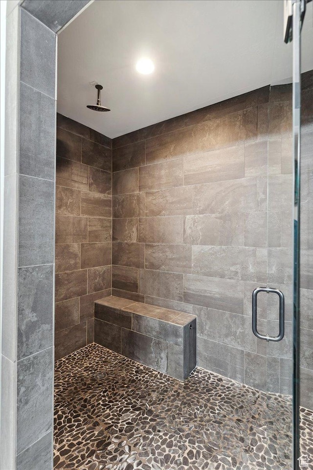 bathroom featuring a shower stall