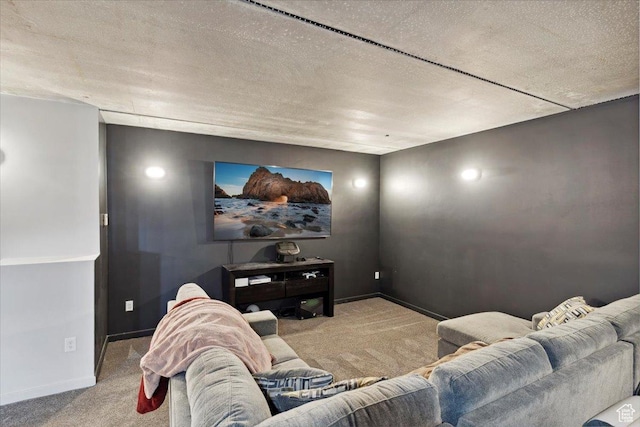 cinema with carpet floors, baseboards, and a textured ceiling