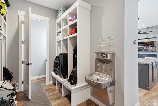 mudroom with light wood-style floors