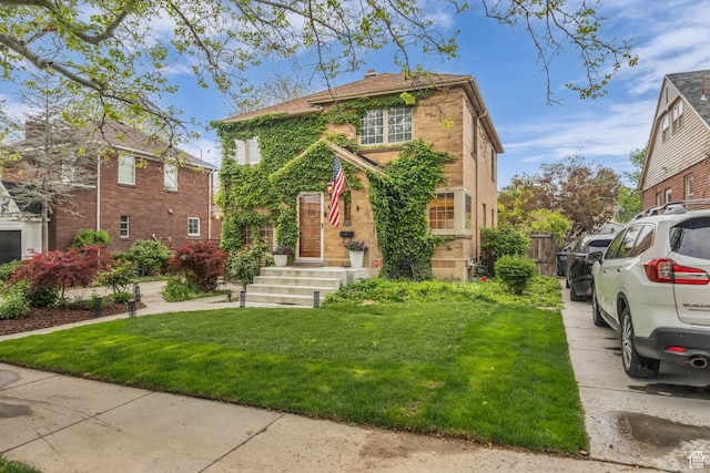 traditional-style home featuring brick siding