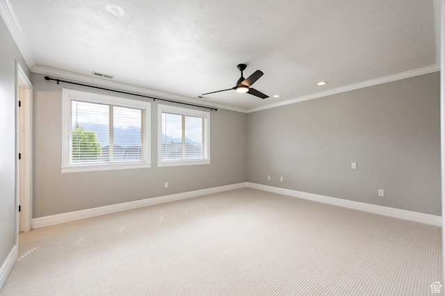 unfurnished room featuring crown molding, ceiling fan, light colored carpet, baseboards, and recessed lighting
