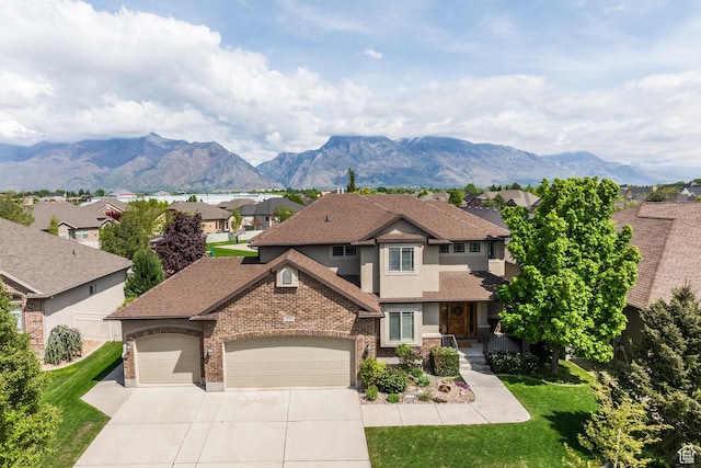 view of front of property with a garage, concrete driveway, a front lawn, a residential view, and stucco siding