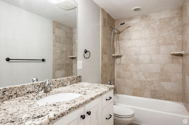 bathroom featuring shower / tub combination, vanity, and toilet
