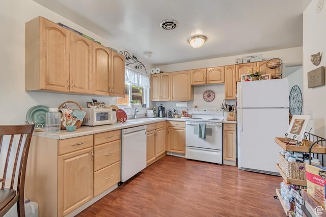 3410 S 2000 E, Millcreek, UT 84109 - kitchen with white appliances, light brown cabinets, light countertops, dark wood-style flooring, and a sink