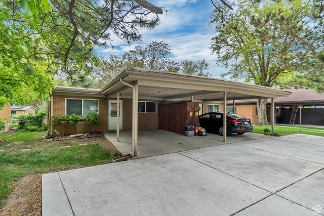 3410 S 2000 E, Millcreek, UT 84109 - view of vehicle parking with concrete driveway and an attached carport