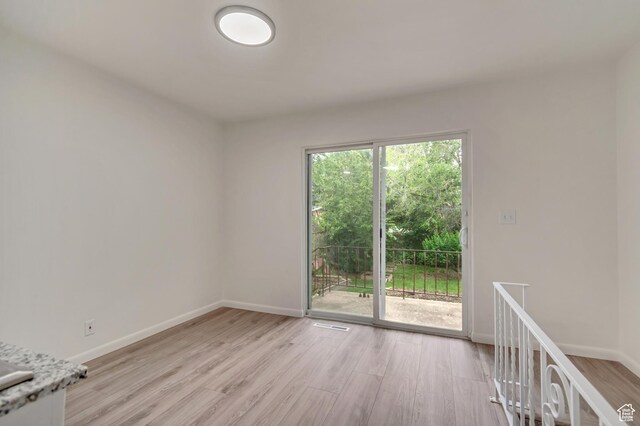 3410 S 2000 E, Millcreek, UT 84109 - empty room featuring light wood finished floors and baseboards