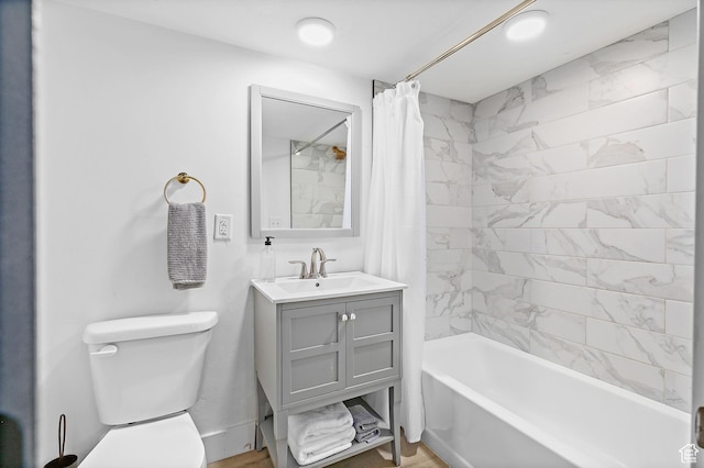 full bathroom with toilet, shower / bath combination with curtain, and vanity