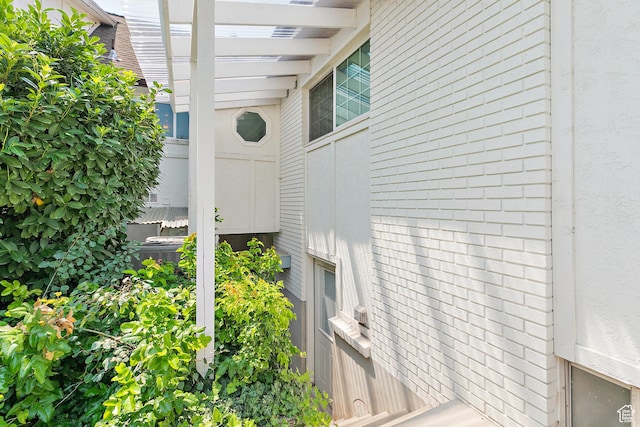 view of property exterior with brick siding