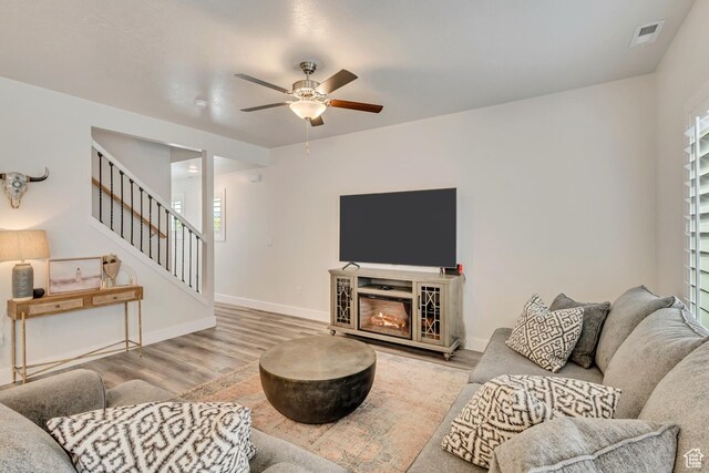 341 N 100 W, Morgan, UT 84050 - living area featuring ceiling fan, wood finished floors, stairs, and baseboards