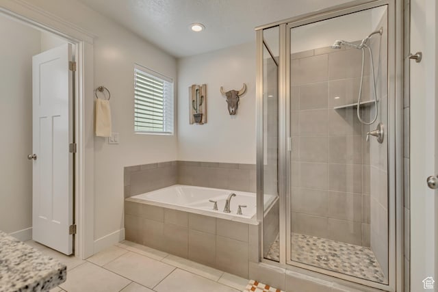 341 N 100 W, Morgan, UT 84050 - full bathroom with a shower stall, a bath, tile patterned floors, and baseboards