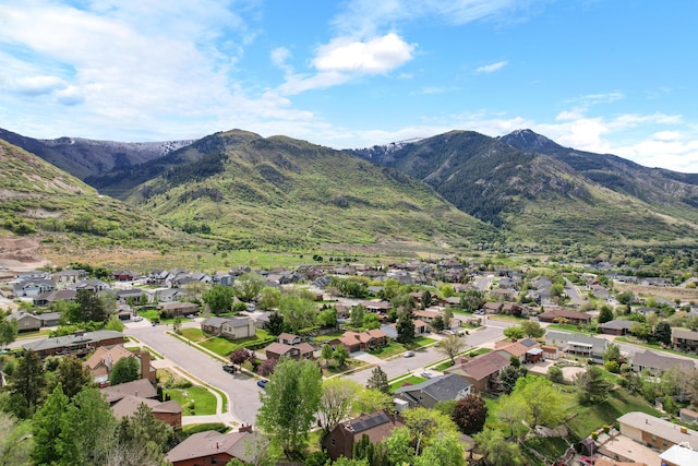 aerial view of residential area featuring a mountain backdrop