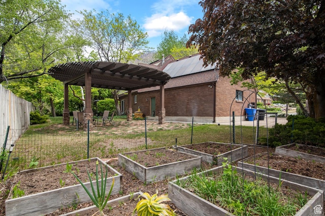 view of yard featuring a garden and a pergola