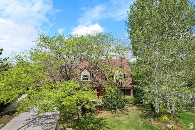 view of front of house featuring a chimney