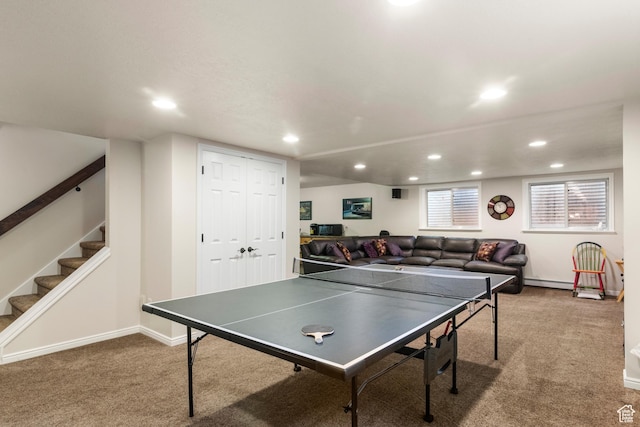 recreation room featuring carpet floors, recessed lighting, baseboard heating, and baseboards