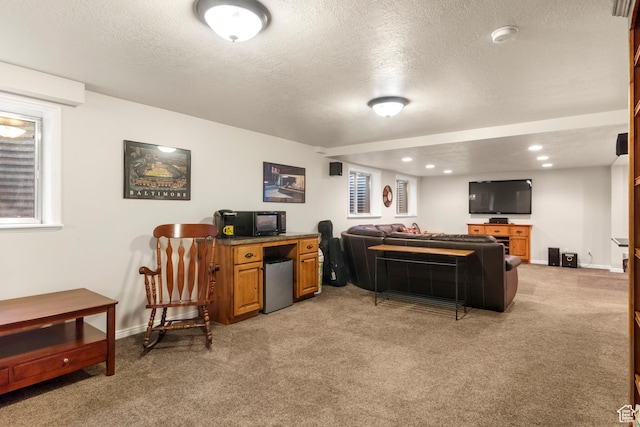 living room featuring light carpet, a textured ceiling, baseboards, and recessed lighting