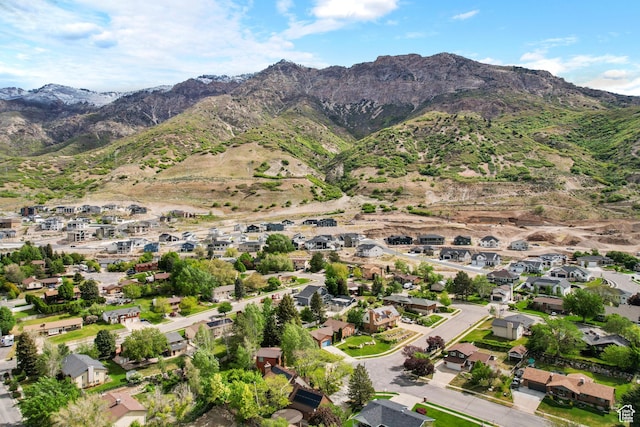 aerial overview of property's location with mountains and nearby suburban area