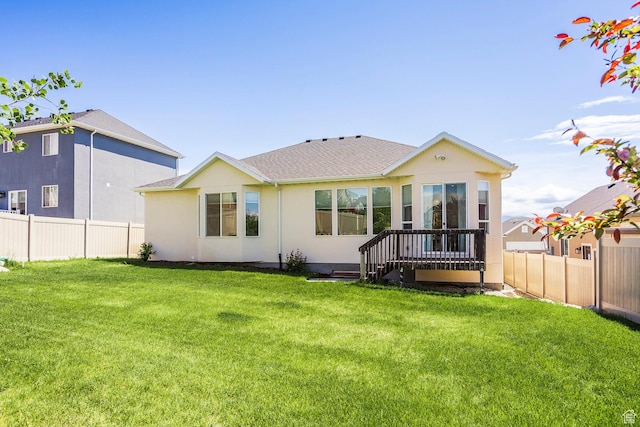 back of property featuring stucco siding and roof with shingles