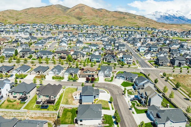 aerial overview of property's location with nearby suburban area and mountains