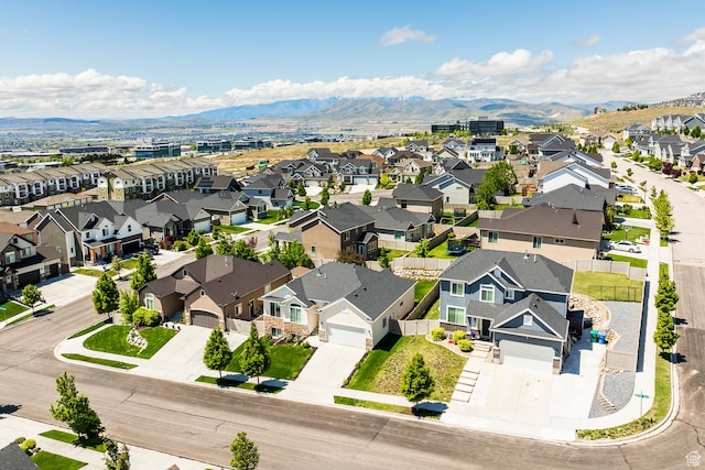 aerial perspective of suburban area featuring a mountain backdrop